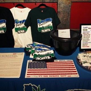 Portland NORML table with merchandise and literature.